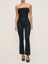 Load image into Gallery viewer, Model wearing high-rise cropped bootcut coated jeans paired with black strapless top and heels