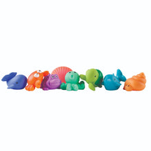 Load image into Gallery viewer, Set of eight colorful rubber sea creature bath toy squirties including dolphin, crab, octopus, and turtle