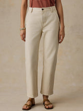 Load image into Gallery viewer, Model wearing wide-leg cropped denim pants with cuffed hem and button closure