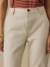 Load image into Gallery viewer, Close-up of high-waisted beige chino pants with front seam detail and single button closure