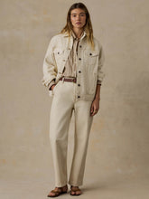 Load image into Gallery viewer, Model wearing an oversized cream denim jacket with chest pockets and button front closure