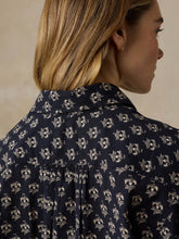 Load image into Gallery viewer, Back detail view of a navy floral print blouse showing collar and pleated yoke
