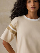 Load image into Gallery viewer, Woman wearing oversized short-sleeve knit tee with varsity stripe sleeve detail, close-up view