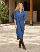 Load image into Gallery viewer, Model wearing a long-sleeve maxi denim shirtdress with button front and knee-high brown boots