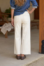 Load image into Gallery viewer, Back view of wide-leg cropped sweatpant trousers worn with denim shirt and loafers