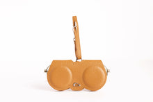Load image into Gallery viewer, Leather eyeglass case with dual circular compartments and wrist strap, front view