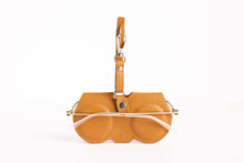 Load image into Gallery viewer, Tan pebbled leather glasses case with strap handle and snap closure holding eyeglasses