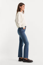 Load image into Gallery viewer, Woman wearing straight-leg mid-rise jeans in medium wash denim, side profile view