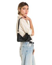 Load image into Gallery viewer, Model wearing cream blouse and jeans carrying black studded leather shoulder bag on arm