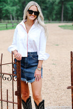 Load image into Gallery viewer, Model wearing cropped white button-up shirt with red piping detail at rustic gate