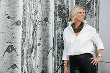 Load image into Gallery viewer, Woman wearing white ruffle collar button down shirt with black leather pants in styled interior setting