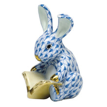 Load image into Gallery viewer, Herend porcelain bunny figurine with blue fishnet pattern holding a golden book