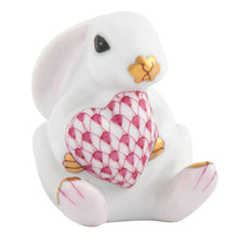 Load image into Gallery viewer, Herend porcelain bunny figurine seated and holding a decorative fishnet-patterned heart