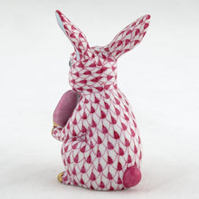 Load image into Gallery viewer, Herend porcelain bunny figurine holding a pickleball, decorated with fishnet pattern