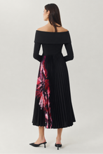 Load image into Gallery viewer, Back view of off-shoulder midi dress with pleated skirt featuring floral print panel