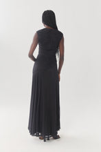 Load image into Gallery viewer, Back view of a ruched sleeveless maxi dress with flared skirt hem on a model