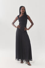 Load image into Gallery viewer, Model wearing a sleeveless ruched maxi dress with asymmetric neckline and flowy skirt
