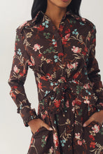 Load image into Gallery viewer, Close-up detail of long-sleeve floral shirt dress with ruffle accents and tie waist
