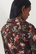 Load image into Gallery viewer, Back view of floral dress with ruffle collar and yoke detail on model