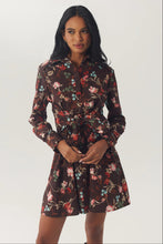 Load image into Gallery viewer, Model wearing a long-sleeve floral shirt dress with tie waist and flared skirt
