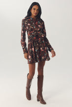 Load image into Gallery viewer, Model wearing long-sleeve floral mini shirtdress with tie waist and knee-high brown boots