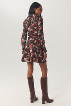 Load image into Gallery viewer, Back view of model wearing long-sleeve floral mini dress with knee-high brown boots
