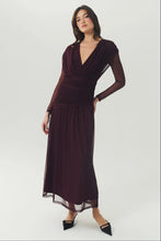 Load image into Gallery viewer, Model wearing a long-sleeve deep V-neck ruched mesh maxi dress with sheer sleeves