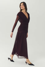 Load image into Gallery viewer, Model wearing a long-sleeve deep V-neck ruched mesh midi dress with drop waist and flowing skirt