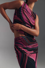Load image into Gallery viewer, Model wearing a pink multi-print asymmetric crop top and matching ruched midi skirt set