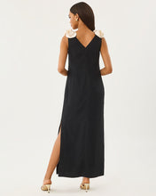 Load image into Gallery viewer, Back view of sleeveless black maxi dress with cream floral shoulder details and side slit