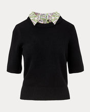 Load image into Gallery viewer, Black short-sleeve knit sweater with decorative printed floral collar detail, laid flat