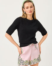 Load image into Gallery viewer, Model wearing a black elbow-sleeve crewneck knit sweater with ribbed hem and cuffs