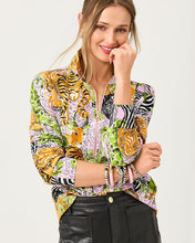 Load image into Gallery viewer, Model wearing a zip-front cropped pullover with vibrant mixed animal print pattern