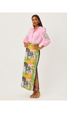 Load image into Gallery viewer, Model wearing pink lace-sleeve button-up shirt paired with colorful printed midi skirt