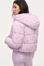 Load image into Gallery viewer, Model wearing a pink floral puffer jacket with hood, shown from the back