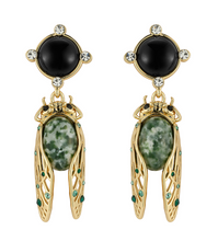Load image into Gallery viewer, Gold drop earrings featuring black onyx tops, crystal accents, and green stone cicada pendants with jeweled wings