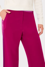 Load image into Gallery viewer, Close-up of wide-leg magenta trousers with satin side stripe trim and side pocket