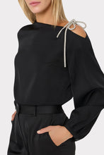 Load image into Gallery viewer, Black satin long-sleeve top with embellished silver bow detail at shoulder cutout