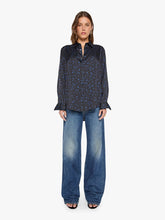 Load image into Gallery viewer, Model wearing a satin button-down shirt with blue star print and wide-leg jeans