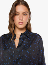 Load image into Gallery viewer, Model wearing black button-down shirt with blue star print, styled with gold jewelry