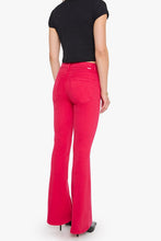 Load image into Gallery viewer, Back view of high-rise flare jeans with rear pockets, paired with black crop top