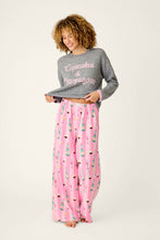 Load image into Gallery viewer, Model wearing pink striped lounge pants with champagne bottle print and coordinating gray sweater