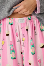 Load image into Gallery viewer, Close-up detail of pink striped pajama pants with champagne bottles and cupcakes print pattern