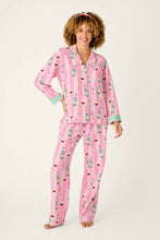 Load image into Gallery viewer, Model wearing pink striped pajama set with champagne and cupcake print, long sleeve button-up top and pants