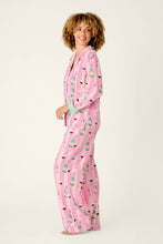 Load image into Gallery viewer, Model wearing pink striped pajama set with champagne and cupcake print, side view