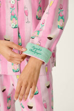 Load image into Gallery viewer, Close-up detail of Cupcakes and Champagne pajama sleeve cuff with embroidered text