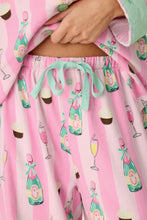 Load image into Gallery viewer, Close-up detail of pink striped pajama pants with champagne bottles and cupcakes print