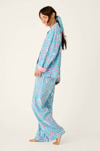 Load image into Gallery viewer, Model wearing light blue candy cane print long sleeve pajama set, side view