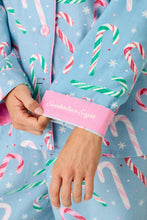 Load image into Gallery viewer, Close-up detail of candy cane print pajama sleeve cuff reading Sweeter than Sugar