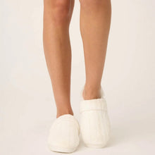 Load image into Gallery viewer, Back view of model wearing ivory cable-knit slip-on slippers with faux fur trim